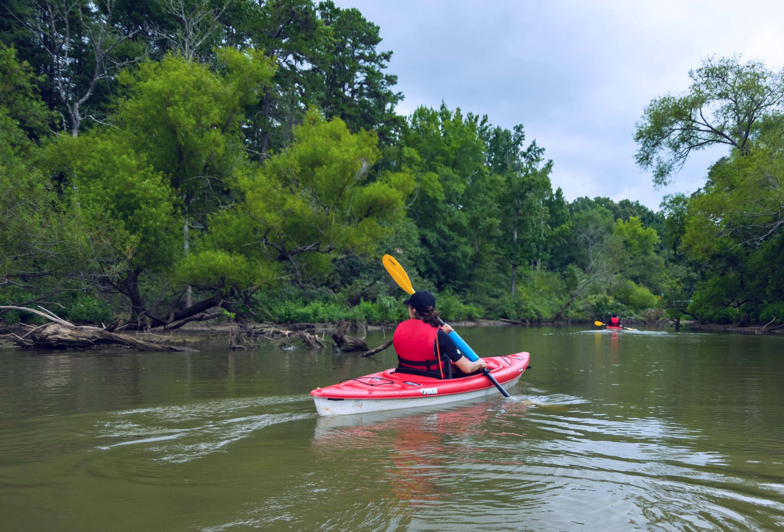 Person kayaking at Occoneechee Lake.